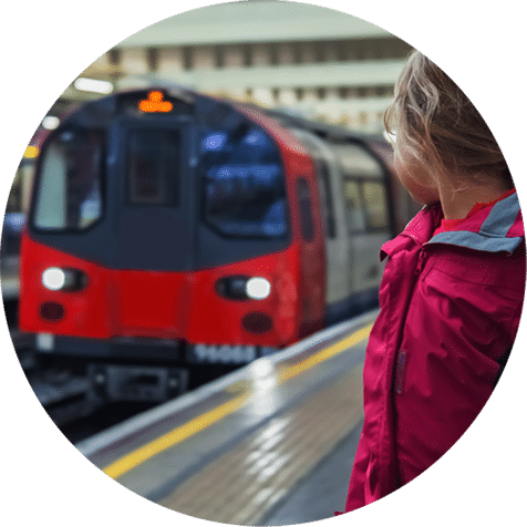 Girl with train in background